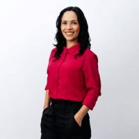 Portrait of Brazilian business woman over neutral background. Confident young latin businesswoman